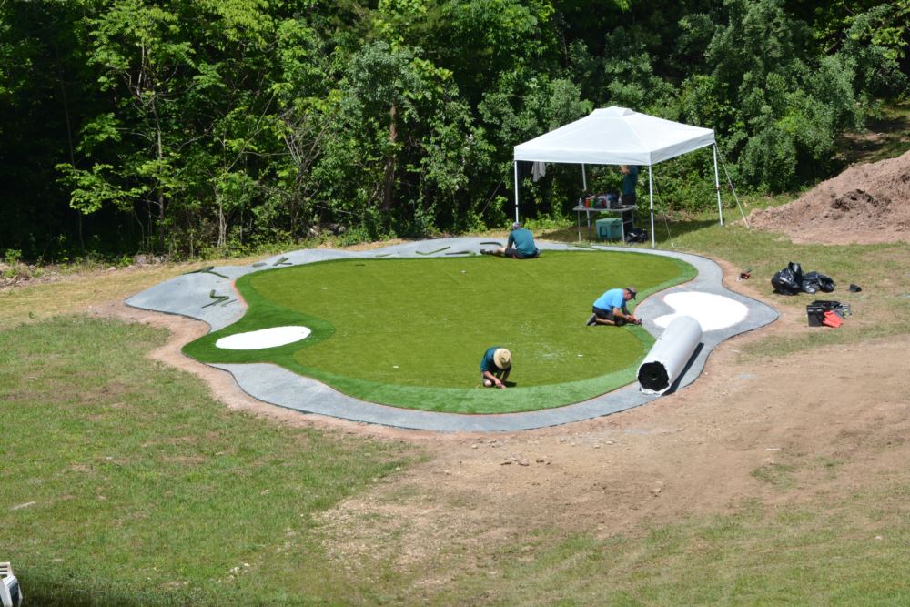 Artificial grass putting green being installed by an expert installation crew