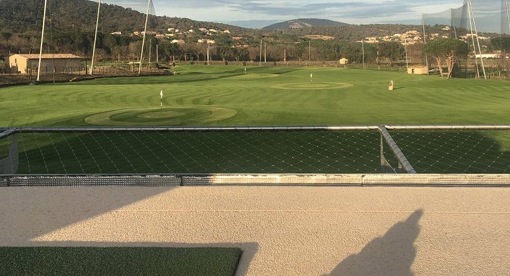 Asheville Synthetic turf beside natural grass golf course