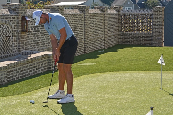 Asheville Golfer putting on synthetic grass